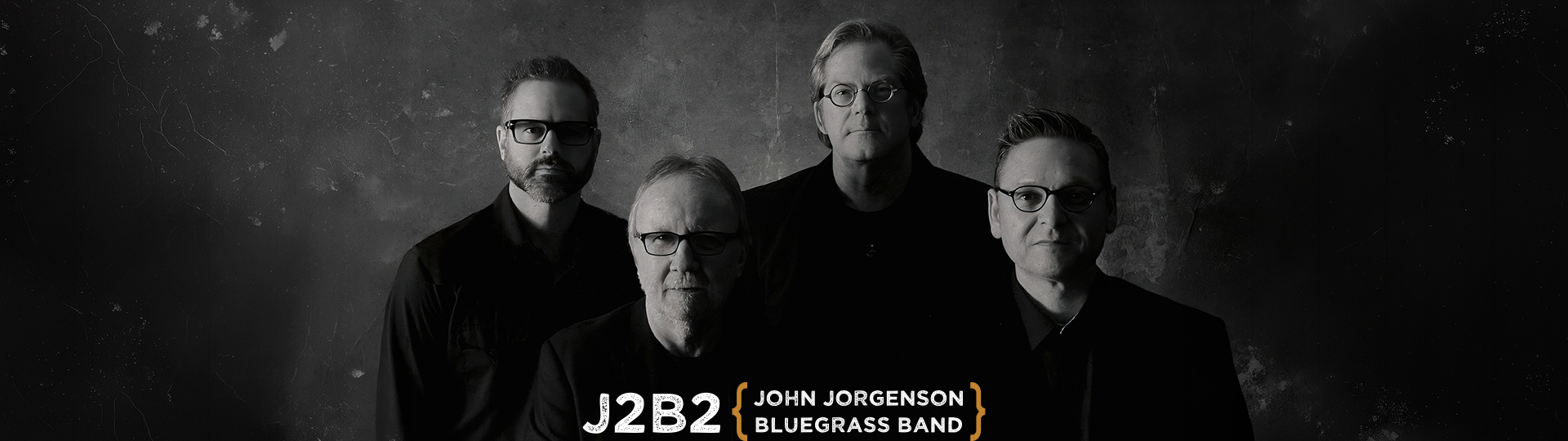Black-and-white promotional image of four musicians for J2B2, the John Jorgenson Bluegrass Band.